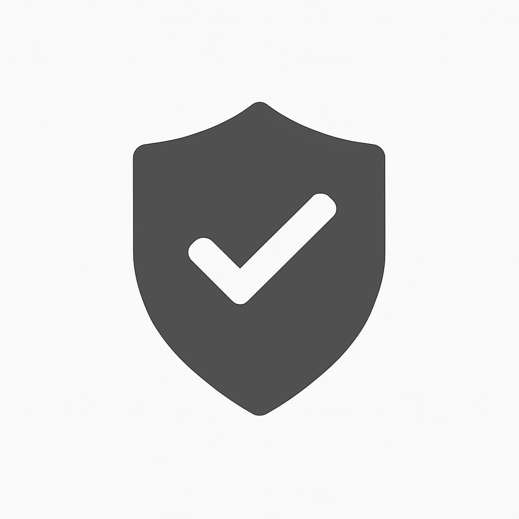 A simple gray shield icon with a white checkmark in the center, symbolizing security, protection, or verification, on a plain white background.